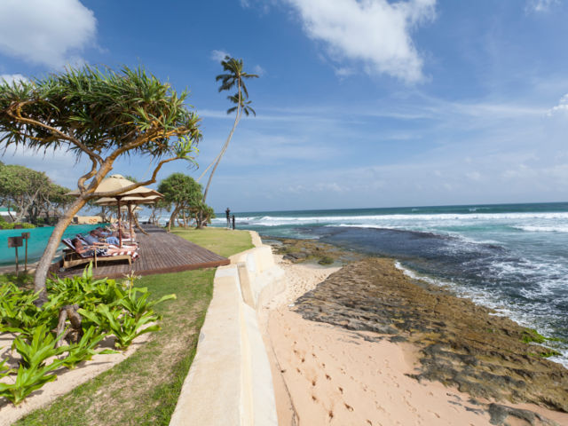 Relaxing on sun deck with sea view at The Fortress Resort & Spa