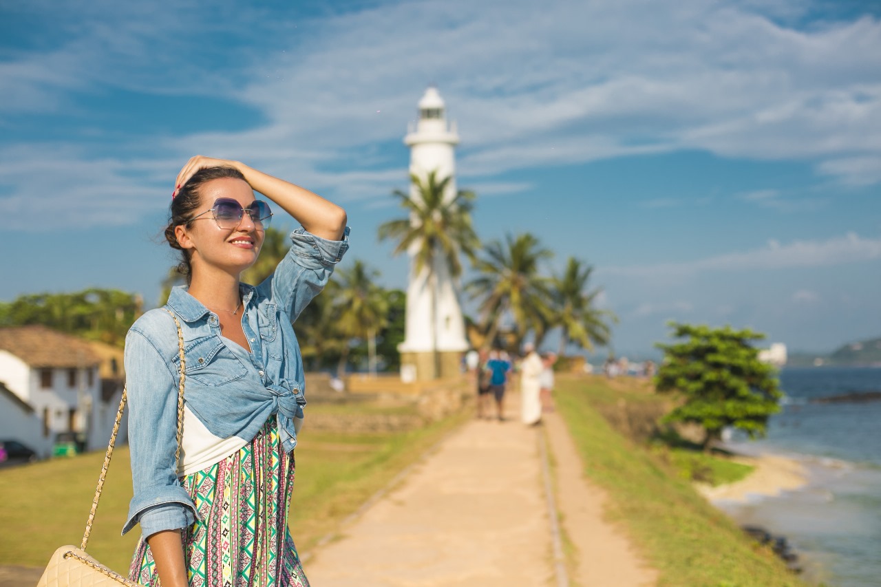 woman near a Galle lighthouse