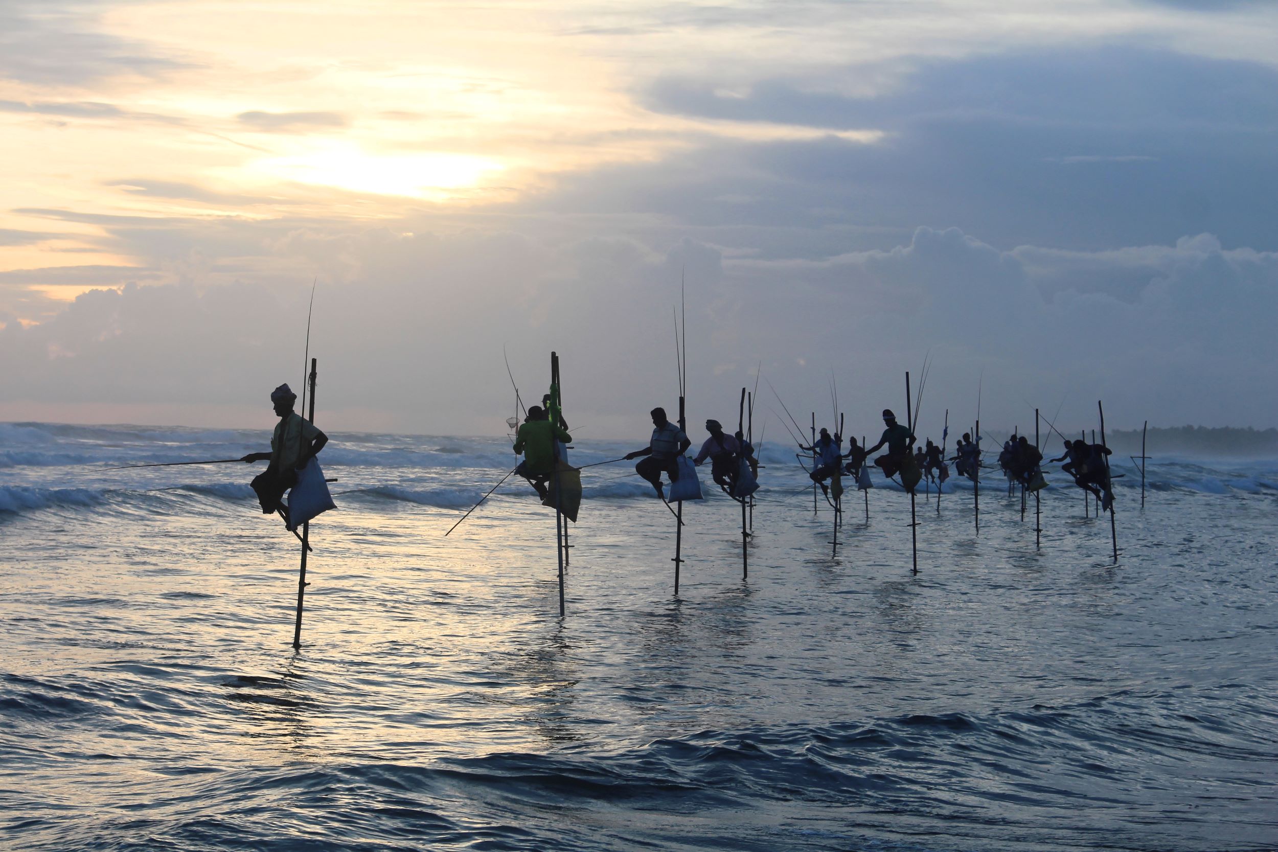Stilt fishermen in Sri Lanka, one of the best countries to visit in April