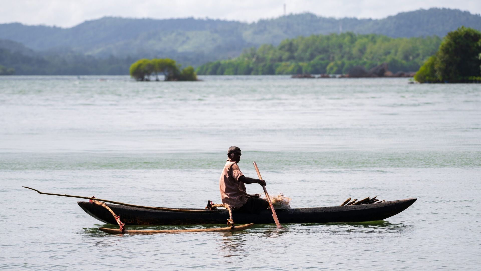 Local fisherman travelling across Koggala Lake in southern Sri Lanka